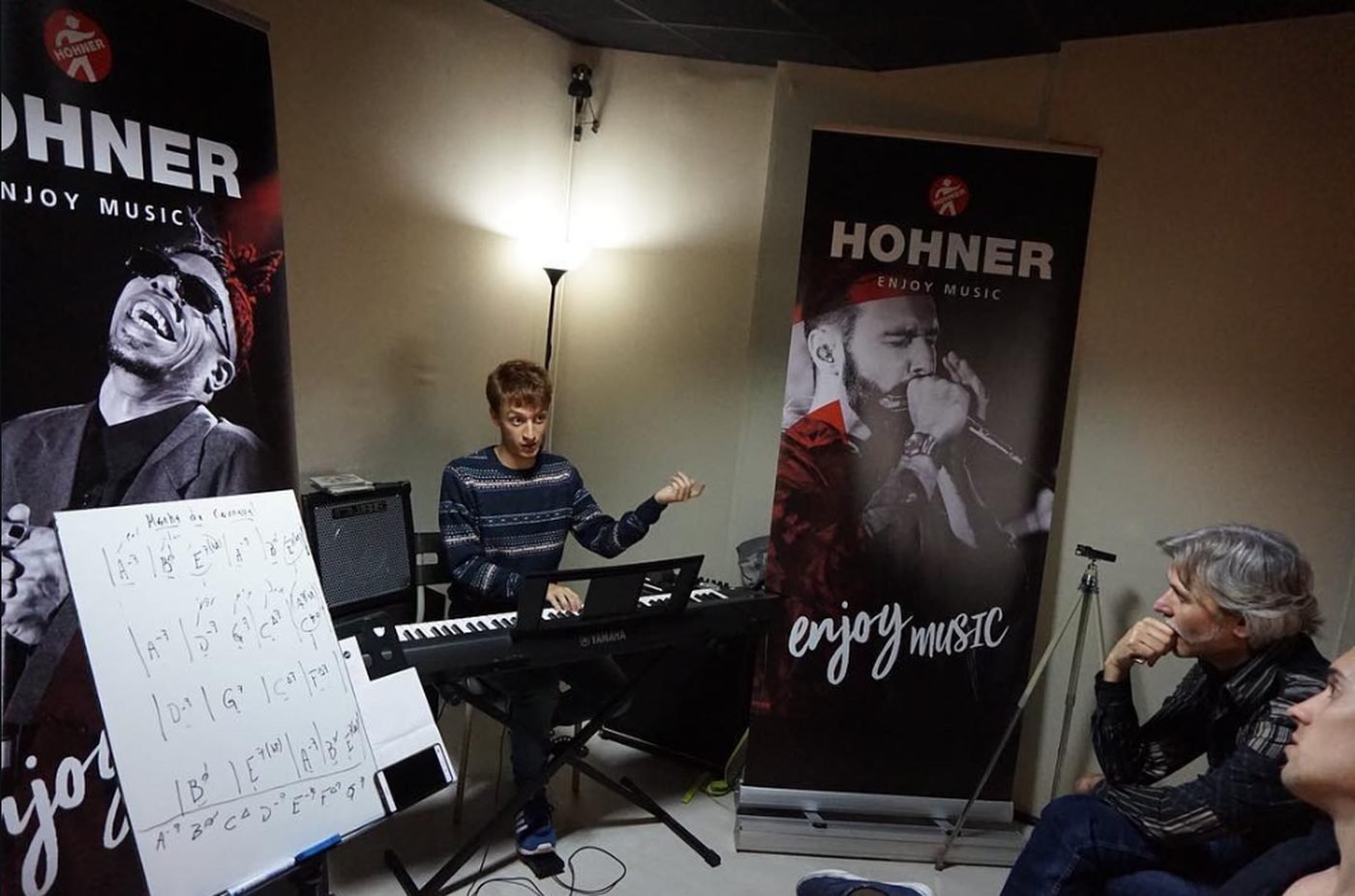 Federico Linari giving a harmonica workshop with Hohner banners